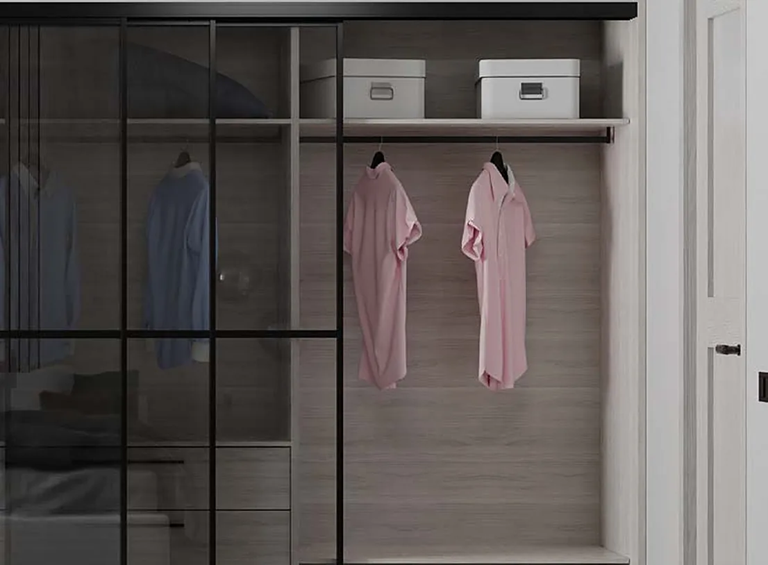 Wardrobe interior seen through Bridge 500 sliding glass doors with shirts on a rail Wardrobe interior seen through Bridge 500 sliding glass doors with shirts on a rail