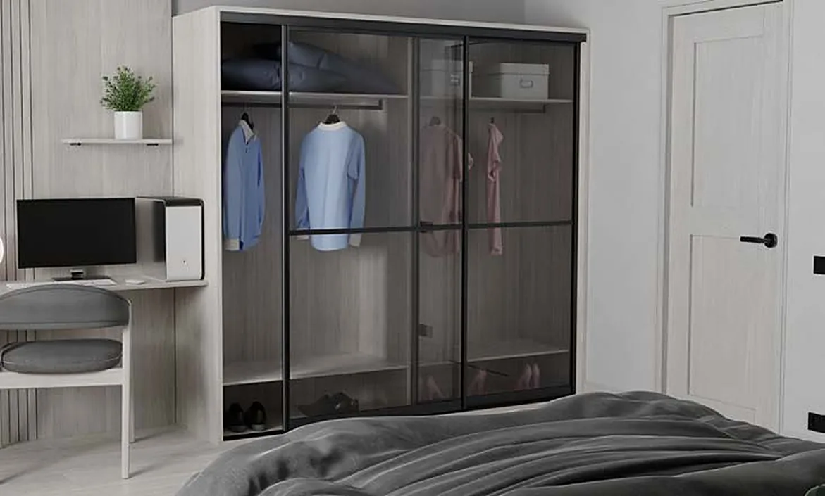 Bridge 500 sliding wardrobe with glass doors in a bedroom with a desk Bridge 500 sliding wardrobe with glass doors in a bedroom with a desk