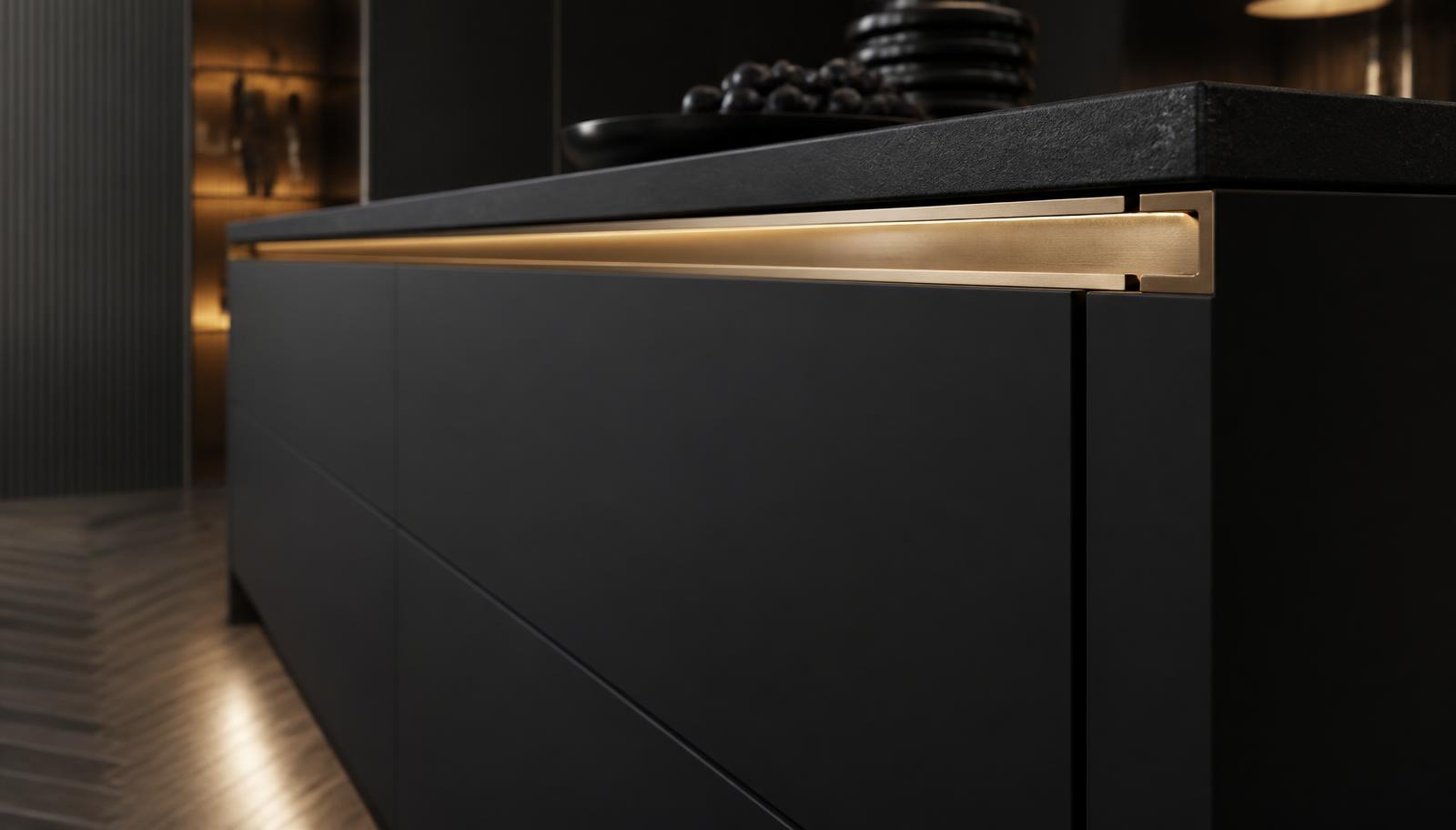Mirano aluminium profile handle in a handleless matte black kitchen Matte black handleless kitchen island with a continuous champagne gold aluminium profile handle running along the drawer fronts