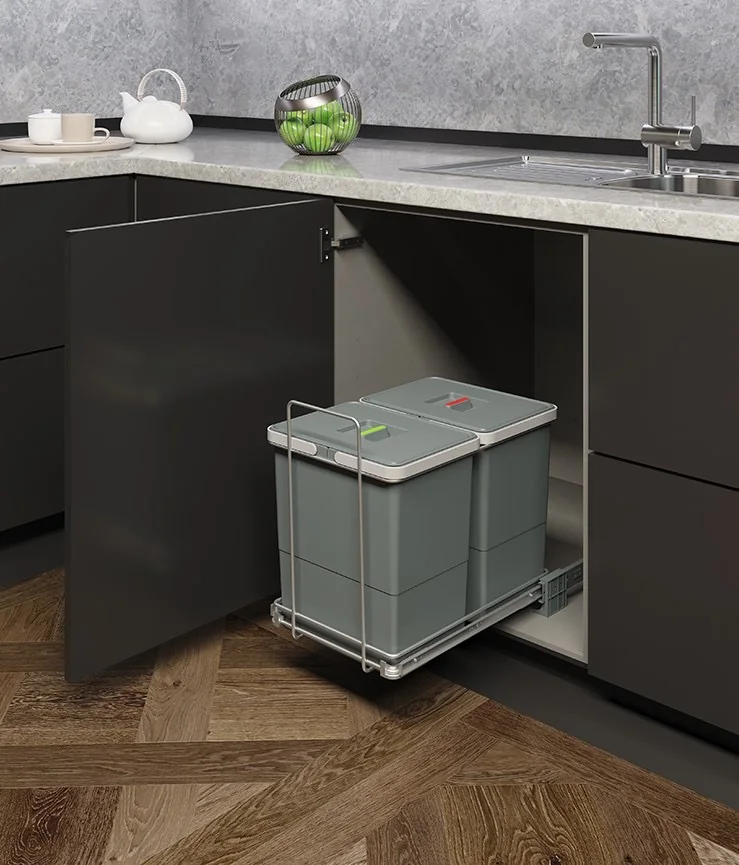 Ecofil twin-bin pull-out waste bin on a wire frame in a dark modular kitchen base cabinet