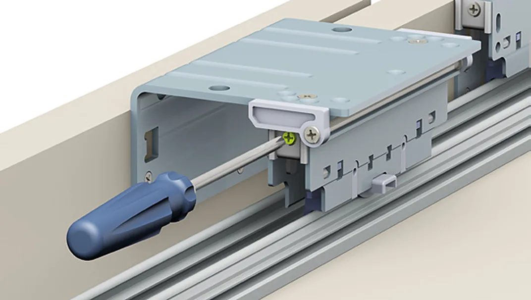 Adjusting an Evolution upper carriage on its rail with a screwdriver Adjusting an Evolution upper carriage on its rail with a screwdriver