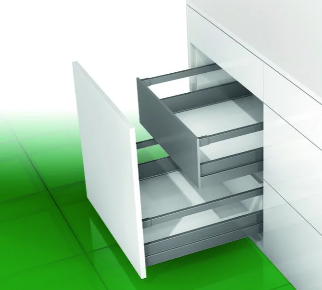 Two inset kitchen drawers with rectangular railings, a shorter drawer above a full-width drawer, in a white modular kitchen